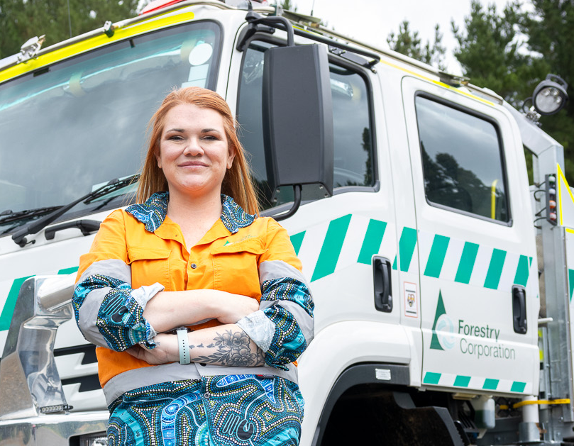 Forestry worker standing in forest